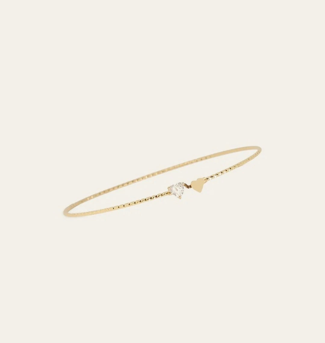 Bracciale rigido Due Cuori in acciaio dorato